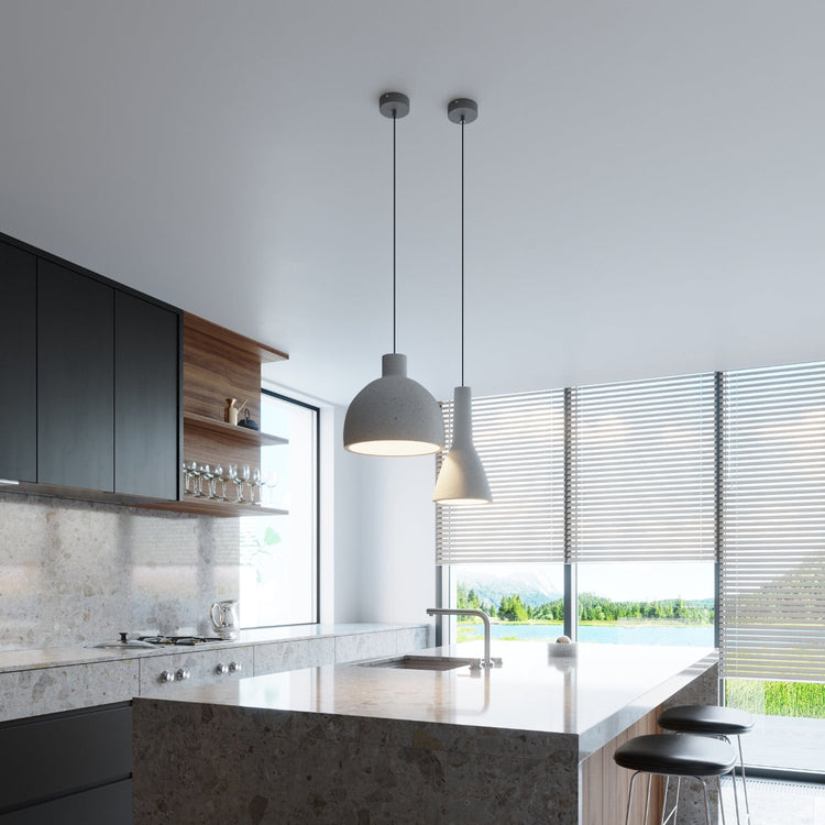 Solstånd minimalist pendant lamps hanging over a dining table